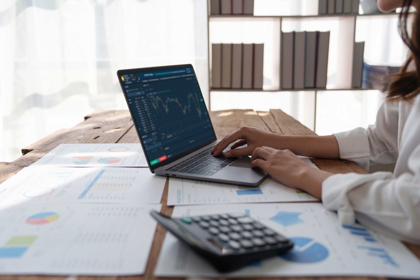 Advisors reviewing financial statements together under a deadline